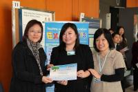 Dr. Ann S.N. Lau (middle) receives Poster Award for her poster and oral presentations